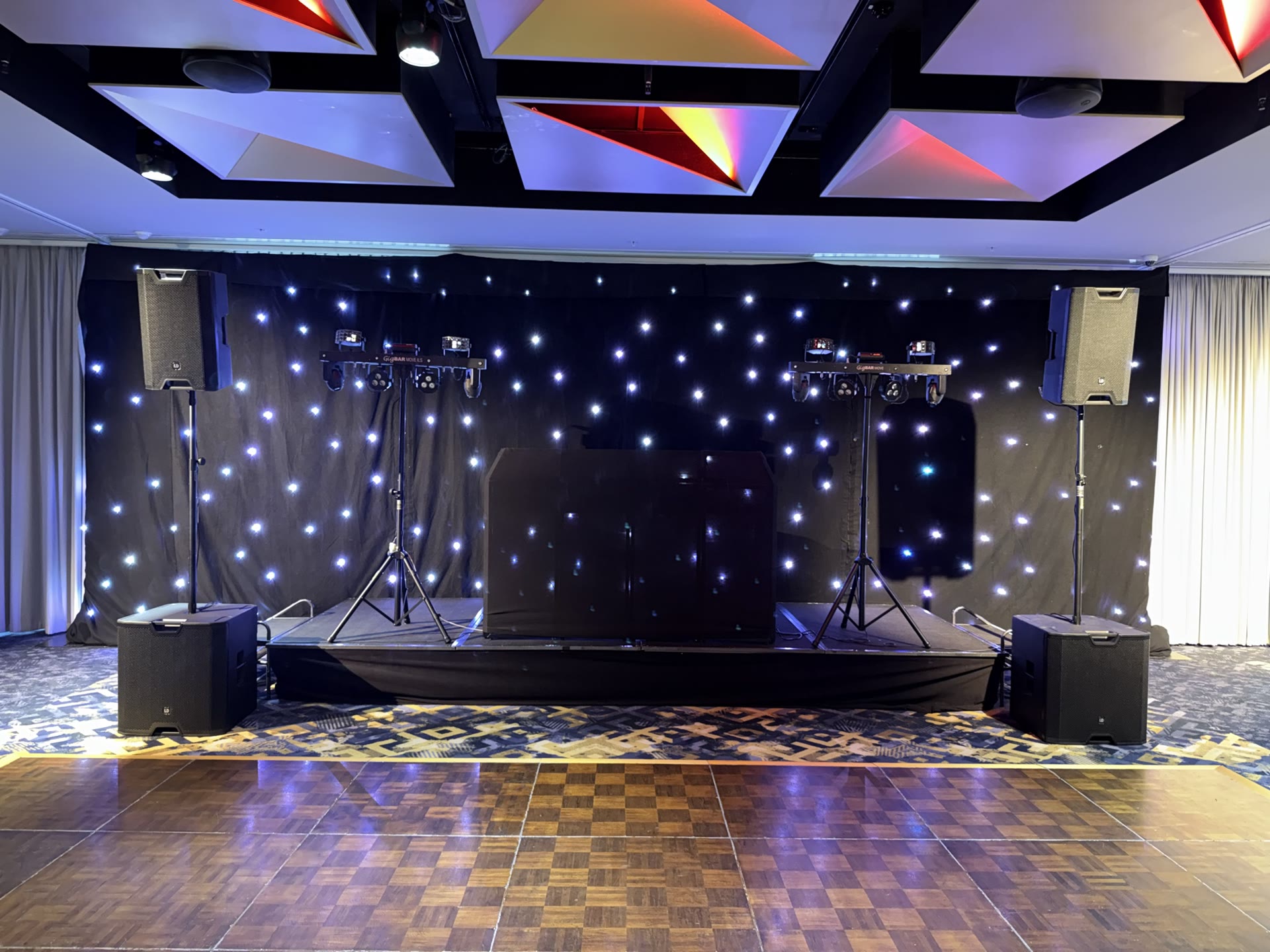 Full DJ rig at Beaumonde on the Point — twin LD Systems tops on stands with subs, starlight backdrop, four moving heads, dancefloor lit and ready. — Beaumonde on the Point, East Perth.